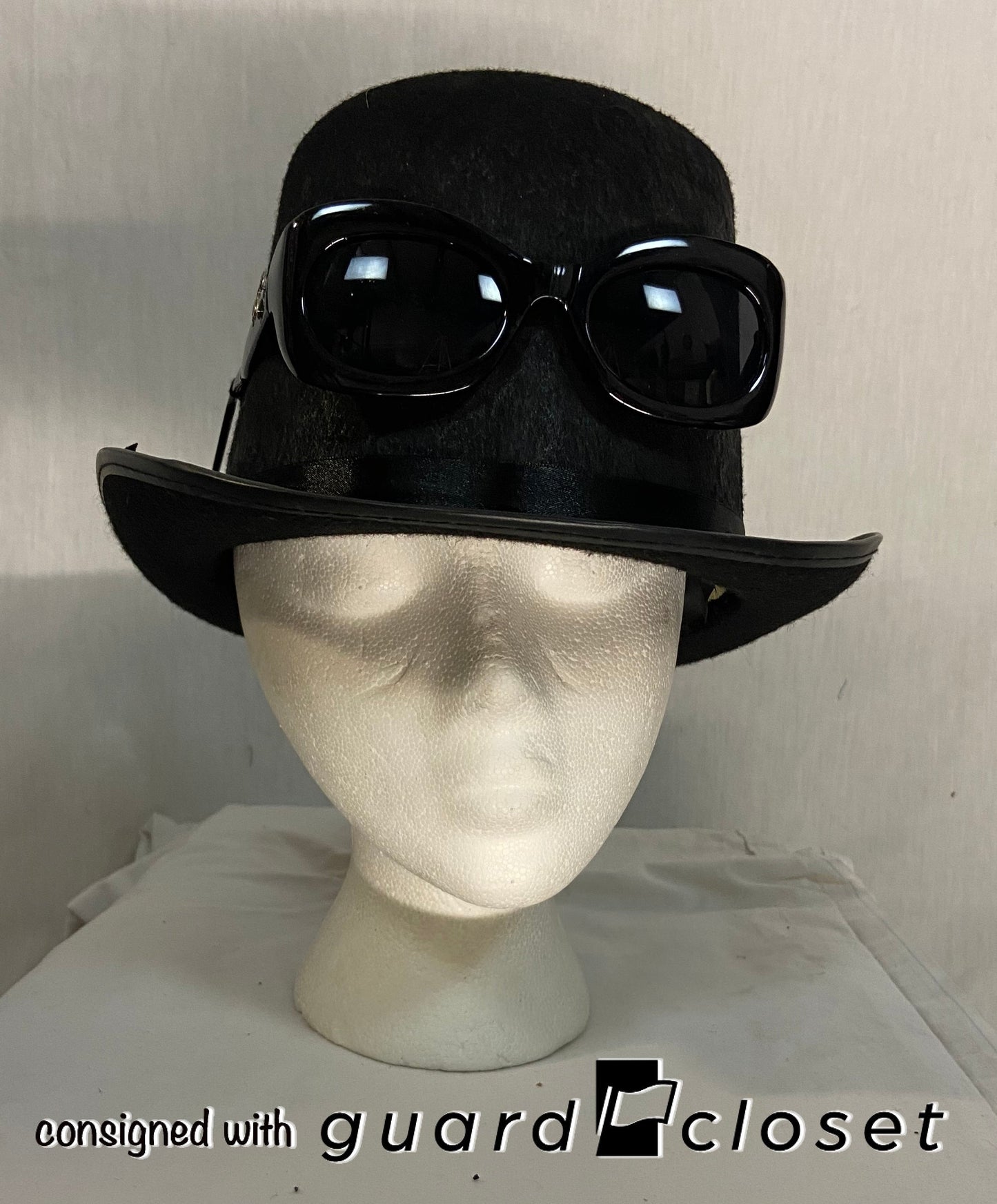 14 black felt hats with attached sunglasses